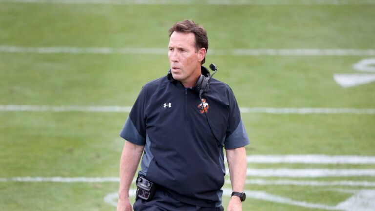 Sam Houston State head coach K.C. Keeler walks across the field after they defeated South Dakota State during the NCAA college FCS Football Championship in Frisco, Texas, Sunday May 16, 2021. Sam Houston State defeated South Dakota State 23-21. (AP Photo/Michael Ainsworth)