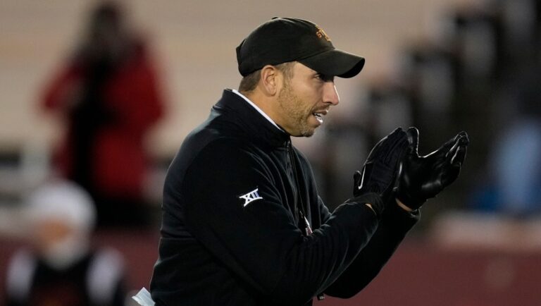 Iowa State head coach Matt Campbell watches his team warmup before an NCAA college football game against Texas Tech, Saturday, Nov. 19, 2022, in Ames, Iowa. (AP Photo/Charlie Neibergall)