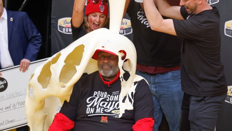 Maryland head coach Mike Locksley is doused with Duke's Mayo after Maryland defeated North Carolina State 16-12 in the Duke's Mayo Bowl NCAA college football game in Charlotte, N.C., Friday, Dec. 30, 2022. (AP Photo/Nell Redmond)