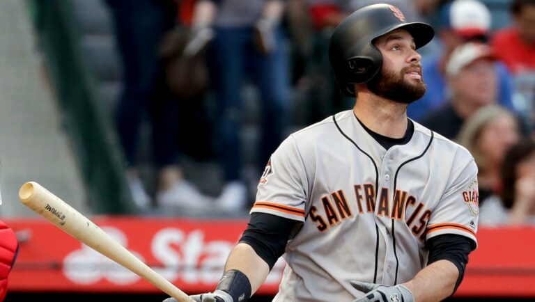 San Francisco Giants' Brandon Belt watches his two-run home run against the Los Angeles Angels during the second inning of a baseball game in Anaheim, Calif., Saturday, April 21, 2018.