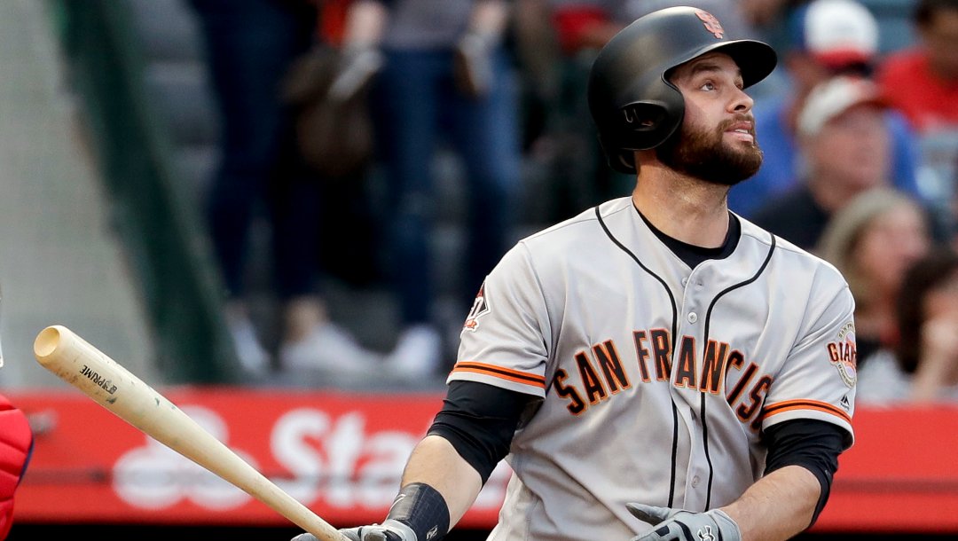 San Francisco Giants' Brandon Belt watches his two-run home run against the Los Angeles Angels during the second inning of a baseball game in Anaheim, Calif., Saturday, April 21, 2018.