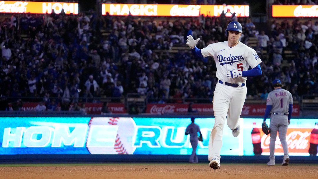Los Angeles Dodgers' Freddie Freeman heads to third after hitting a two-run home run during the fifth inning of a baseball game against the New York Mets Monday, April 17, 2023, in Los Angeles.