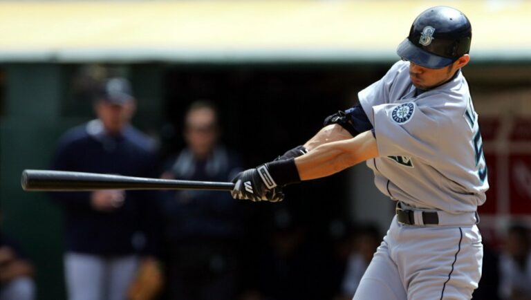 Seattle Mariners' Ichiro Suzuki hits an RBI single off Oakland Athletics' starting pitcher Mark Redman during the third inning of their game in Oakland, Calif., Thursday Sept. 30, 2004. The hit was Ichiro's 256th of the season.