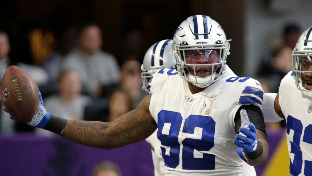 Dallas Cowboys defensive end Dorance Armstrong (92) celebrates after recovering a fumble by Minnesota Vikings quarterback Kirk Cousins during the first half of an NFL football game, Sunday, Nov. 20, 2022, in Minneapolis. (AP Photo/Andy Clayton-King)