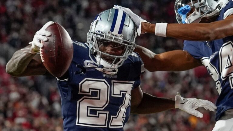 Dallas Cowboys safety Jayron Kearse (27) celebrates with safety Israel Mukuamu after intercepting the ball against Tampa Bay Buccaneers quarterback Tom Brady during the first half of an NFL wild-card football game, Monday, Jan. 16, 2023, in Tampa, Fla. (AP Photo/Chris O'Meara)