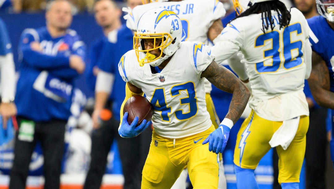 Los Angeles Chargers cornerback Michael Davis (43) returns an interception during an NFL football game against the Indianapolis Colts, Monday, Dec. 26, 2022, in Indianapolis. (AP Photo/Zach Bolinger)