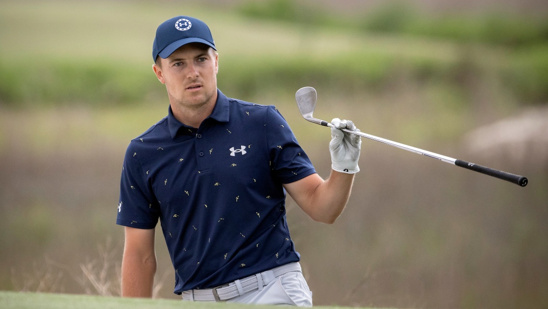 Jordan Spieth watches his shot from a bunker on the 18th hole during a one-hole playoff at the RBC Heritage golf tournament, Sunday, April 17, 2022, in Hilton Head Island, S.C.