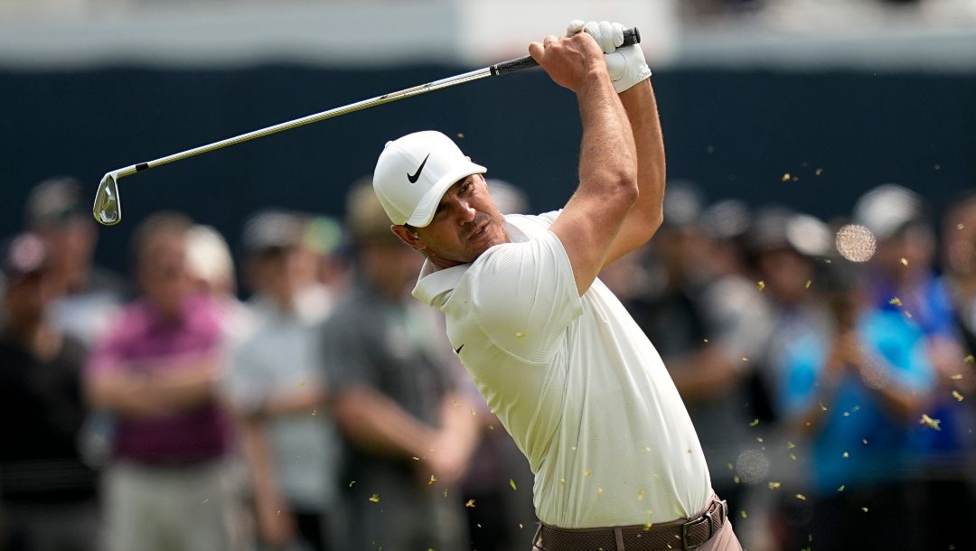 Brooks Koepka hits from the fairway on the fourth hole during the final round of the PGA Championship golf tournament at Oak Hill Country Club on Sunday, May 21, 2023, in Pittsford, N.Y.