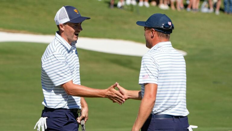 Justin Thomas and Jordan Spieth celebrate a win on the 12th green during their fourball match at the Presidents Cup golf tournament at the Quail Hollow Club, Friday, Sept. 23, 2022, in Charlotte, N.C.