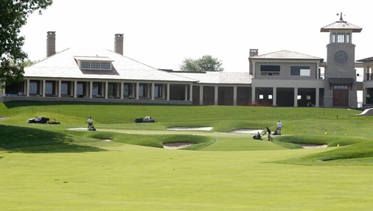 This Wednesday, May 22, 2013, file photo shows the clubhouse and 18th fairway at Muirfield Village Golf Club in Dublin, Ohio.