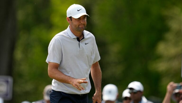 Scottie Scheffler waves after his putt on the seventh hole during the final round of the PGA Championship golf tournament at Oak Hill Country Club on Sunday, May 21, 2023, in Pittsford, N.Y.