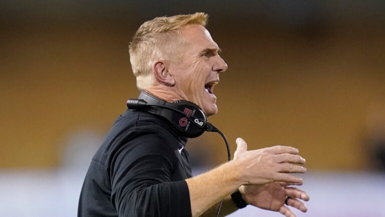 FILE - Utah State head coach Blake Anderson shouts to his team in the first half during an NCAA college football game against BYU on Oct. 1, 2021, in Logan, Utah. The No. 19 San Diego State Aztecs have called the Los Angeles suburbs their home for two seasons while they're building a new stadium in Mission Valley. They'll host Utah State in the Mountain West Conference championship game Saturday in Carson. (AP Photo/Rick Bowmer, File)