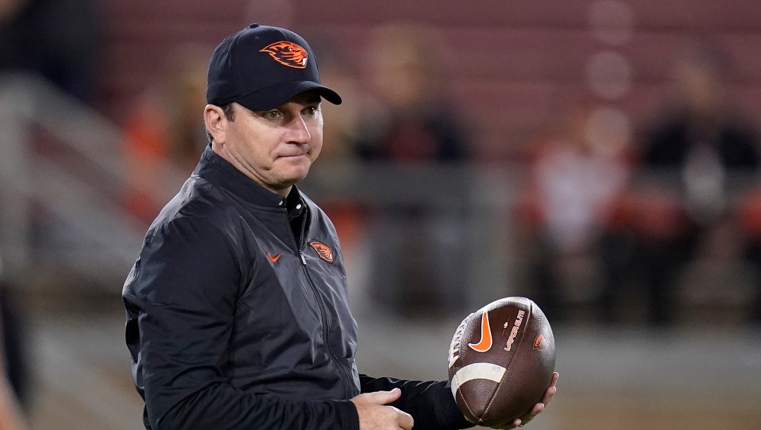 Oregon State coach Jonathan Smith stands on the field before the team's NCAA college football game against Stanford in Stanford, Calif., Saturday, Oct. 8, 2022. (AP Photo/Godofredo A. Vásquez)
