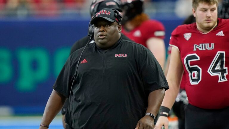 FILE -Northern Illinois head coach Thomas Hammock walks the sideline during the first half of an NCAA college football game against Kent State, Saturday, Dec. 4, 2021, in Detroit. Northern Illinois went from lovable underdog to leader of the Mid-American Conference pack in one season. Keeping the title will be no walk in the park for the Huskies. After going from winless in 2020 to conference champs in 2021, The Huskies will try to become just the third team since 2001 to win consecutive conference crowns and the first since Northern Illinois last achieved the feat in 2011-12. (AP Photo/Carlos Osorio, File)