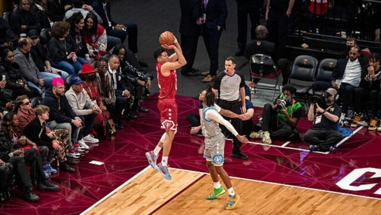 Devin Booker of the Phoenix Suns shoots of Cleveland Cavaliers’ Darius Garland during the 2022 NBA All-Star Game.