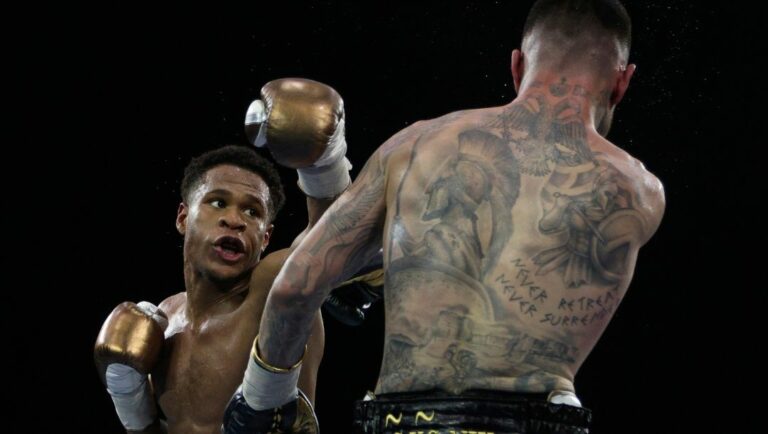 George Kambosos Jr. of Australia, right, and United States' Devin Haney compete as Haney defends his undisputed lightweight boxing title.