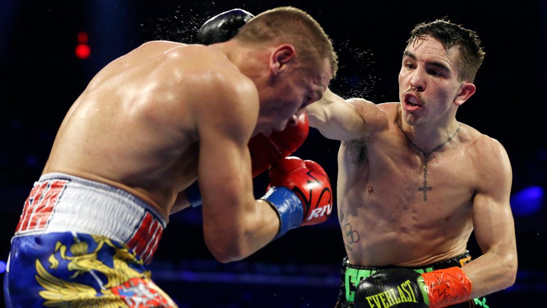 Ireland's Michael Conlan, right, punches Russia's Vladimir Nikitin during the fifth round.