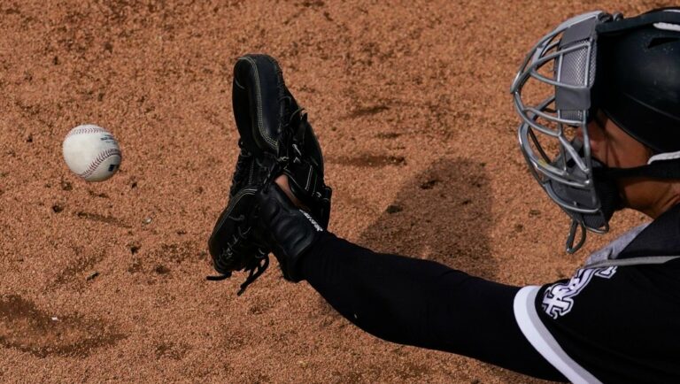 Chicago White Sox catcher Adam Hackenberg catches a throw in the bullpen during the fifth inning of a spring training baseball game against the Milwaukee Brewers in Glendale, Ariz., Tuesday, March 7, 2023.