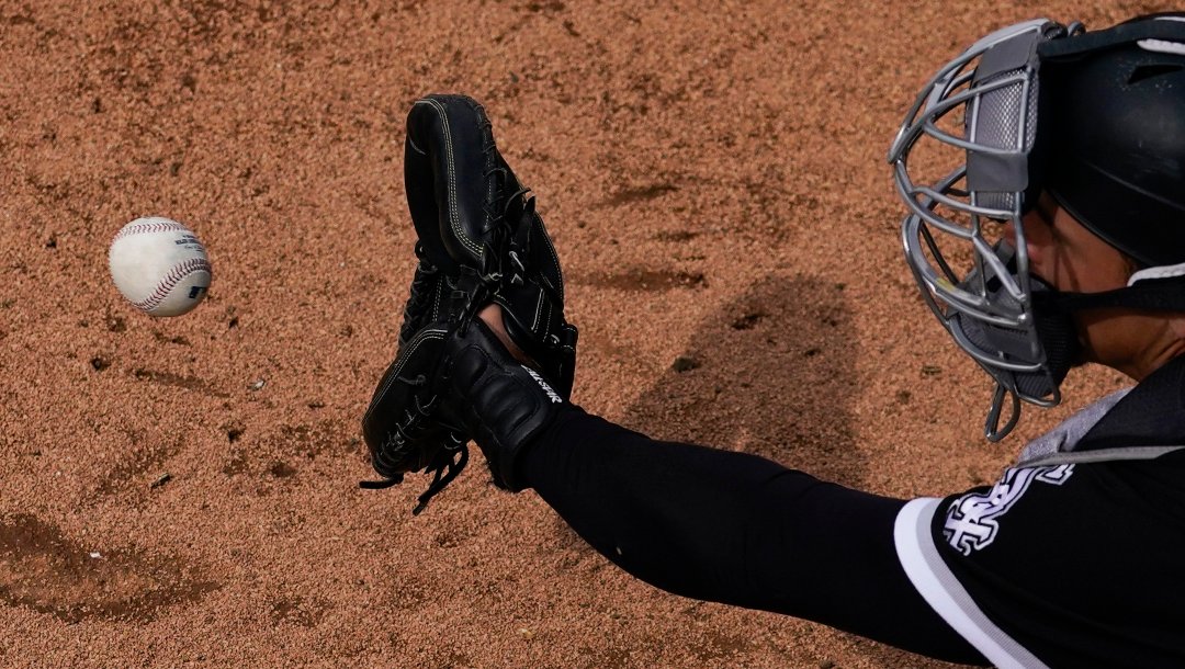 Chicago White Sox catcher Adam Hackenberg catches a throw in the bullpen during the fifth inning of a spring training baseball game against the Milwaukee Brewers in Glendale, Ariz., Tuesday, March 7, 2023.