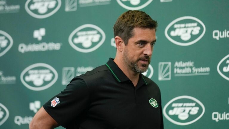 New York Jets' quarterback Aaron Rodgers arrives for a news conference at the Jets' training facility in Florham Park, N.J., Wednesday, April 26, 2023. (AP Photo/Seth Wenig)