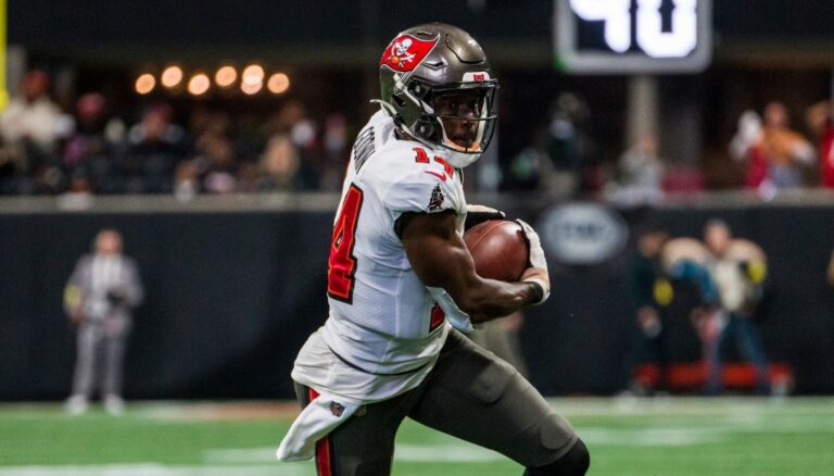 Tampa Bay Buccaneers wide receiver Chris Godwin (14) runs the ball during the first half of an NFL football game against the Atlanta Falcons, Sunday, Jan. 8, 2023, in Atlanta. The Atlanta Falcons won 30-17. (AP Photo/Danny Karnik)