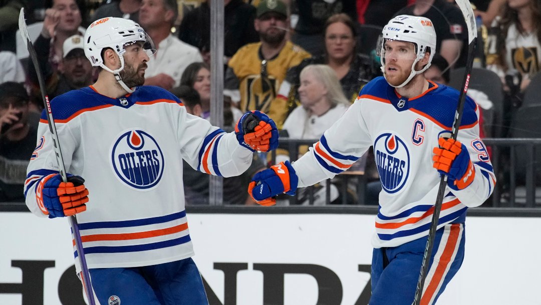 Edmonton Oilers center Connor McDavid, right, celebrates after scoring against the Vegas Golden Knights during the third period of Game 5 of an NHL hockey Stanley Cup second-round playoff series Friday, May 12, 2023, in Las Vegas.