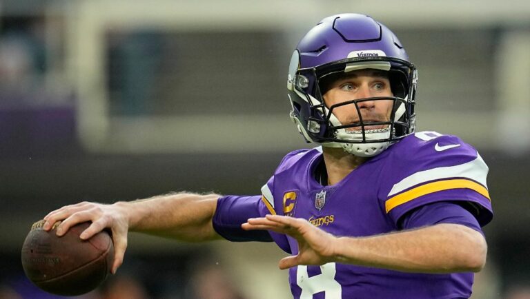 Minnesota Vikings quarterback Kirk Cousins (8) looks to pass during the first half of an NFL wild-card football game against the New York Giants, Sunday, Jan. 15, 2023, in Minneapolis. The Vikings reached an agreement with quarterback Kirk Cousins on Tuesday, March 14, to change bonus language in his existing contract that cleared $16 million from their salary cap for 2023, according to a person with knowledge of the negotiation.