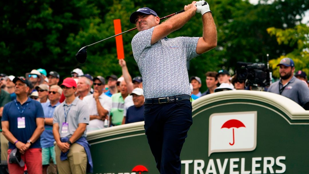 Ryan Armour watches his shot on the first hole during the second round of the Travelers Championship golf tournament at TPC River Highlands, Friday, June 24, 2022, in Cromwell, Conn. Armour was supposed to be out with a rib injury until late October. But he recovered in time to earn back his PGA Tour card and opens the season on Thursday, Sept. 15, 2022.