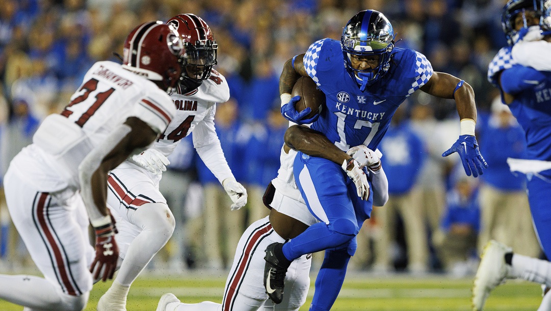 South Carolina defensive back DQ Smith, behind, brings down Kentucky running back JuTahn McClain (17) an NCAA college football game in Lexington, Ky., Saturday, Oct. 8, 2022.
