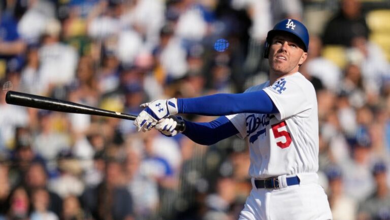 Los Angeles Dodgers' Freddie Freeman (5) follows through on a swing during a baseball game against the New York Yankees in Los Angeles, Sunday, June 4, 2023.