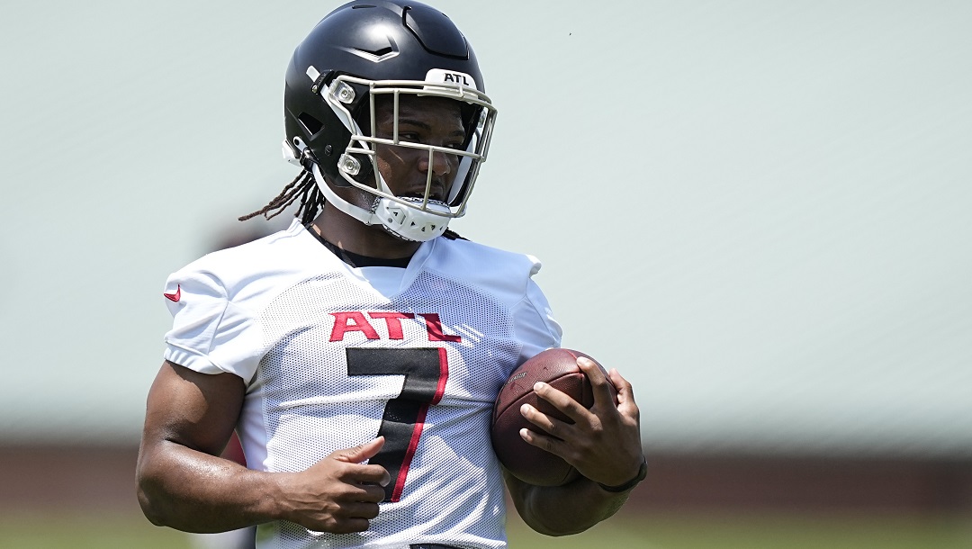 Atlanta Falcons running back Bijan Robinson (7) runs drills during the NFL football team's rookie minicamp, Saturday, May 13, 2023, in Flowery Branch, Ga.
