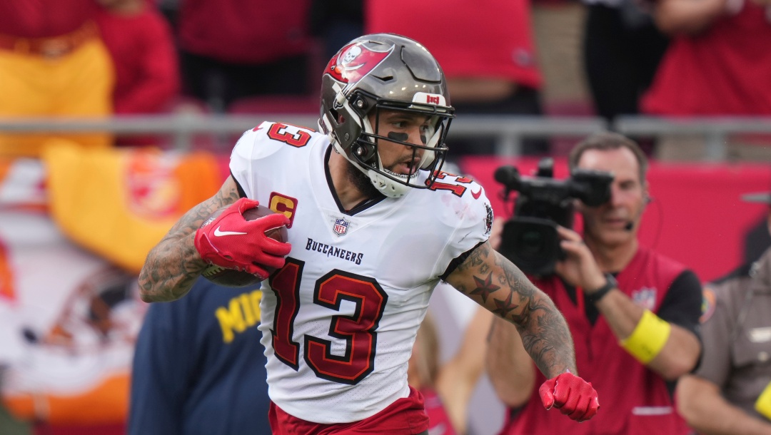 Tampa Bay Buccaneers wide receiver Mike Evans (13) looks back at a defender after his first of three deep touchdown receptions during an NFL football game against the Carolina Panthers, Sunday, January 1, 2023, in Tampa, Fla.