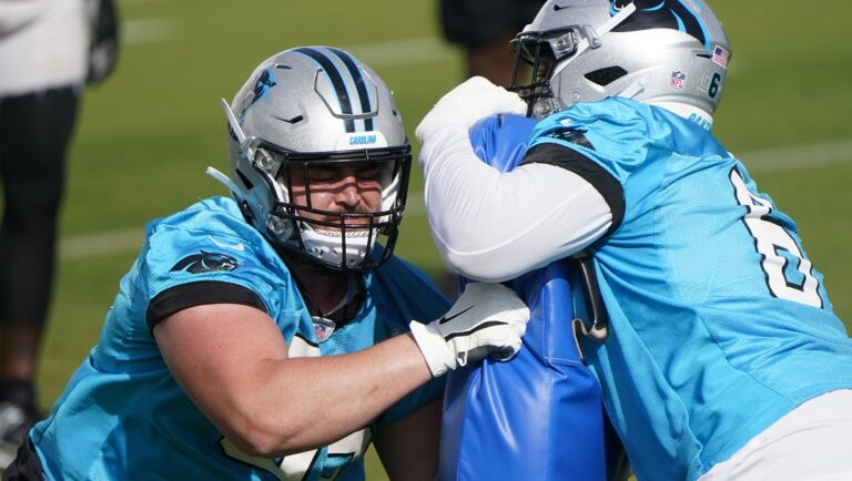 Carolina Panthers offensive tackles J.D. DiRenzo, left, and Ricky Lee (61) run a drill during NFL football practice, Thursday, June 1, 2023, in Charlotte, N.C.