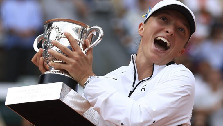 Poland's Iga Swiatek celebrates winning the women's final match of the French Open tennis tournament against Karolina Muchova of the Czech Republic in three sets, 6-2, 5-7, 6-4, at the Roland Garros stadium in Paris, Saturday, June 10, 2023.