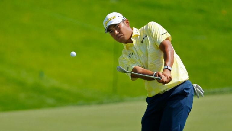Hideki Matsuyama hits onto the 16th green during the fourth round at the 3M Open golf tournament at the Tournament Players Club, Sunday, July 30, 2023, in Blaine, Minn.