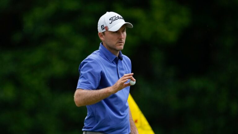 Russell Henley waves after his putt on the 15th hole during the second round of the Masters golf tournament at Augusta National Golf Club on Friday, April 7, 2023, in Augusta, Ga.