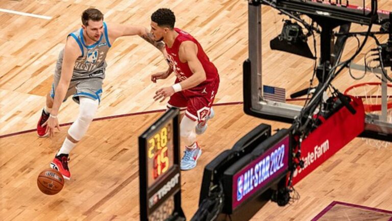 Luka Doncic drives to the basket against Devin Booker during the 2022 NBA All-Star Game.