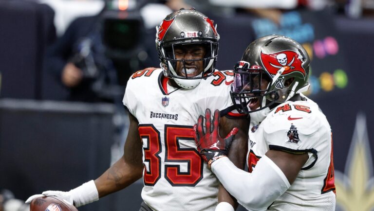 Tampa Bay Buccaneers cornerback Jamel Dean (35) celebrates with linebacker Devin White (45) after an interception against the New Orleans Saints during the first half of an NFL football game in New Orleans, Sunday, Sept. 18, 2022. (AP Photo/Butch Dill)