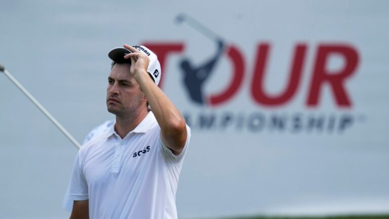 Patrick Cantlay waits his turn to putt on the 18th green during the weather delayed third round of the Tour Championship golf tournament at East Lake Golf Club Sunday, Aug. 28, 2022, in Atlanta.