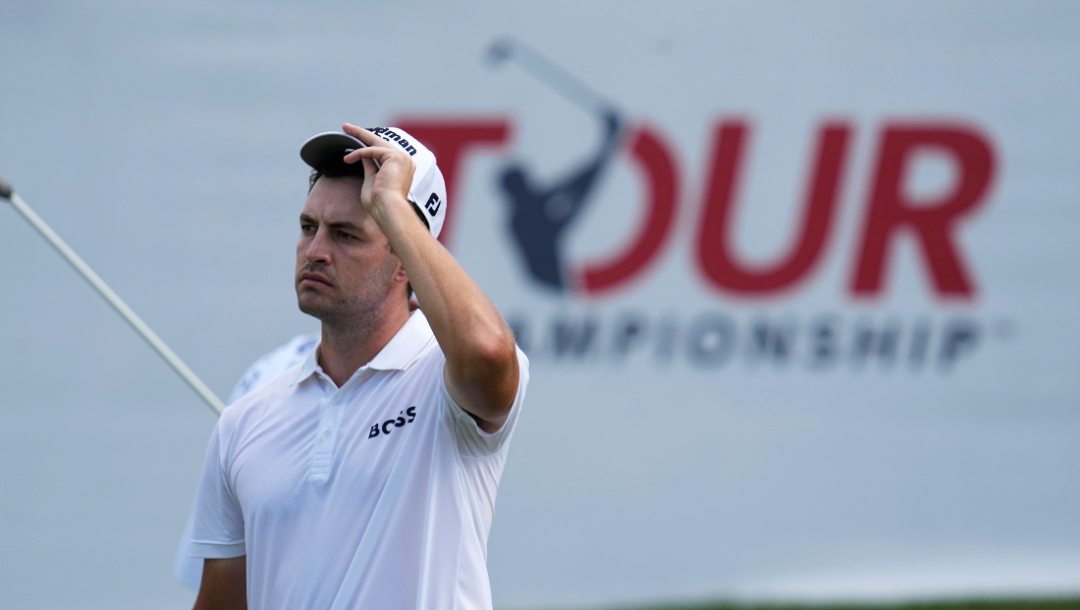 Patrick Cantlay waits his turn to putt on the 18th green during the weather delayed third round of the Tour Championship golf tournament at East Lake Golf Club Sunday, Aug. 28, 2022, in Atlanta.