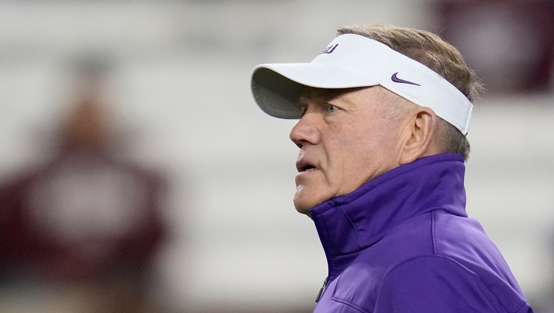 LSU head coach Brian Kelly watches his team warm up before the start of an NCAA college football game against Texas A&M Saturday, Nov. 26, 2022, in College Station, Texas. (AP Photo/Sam Craft)