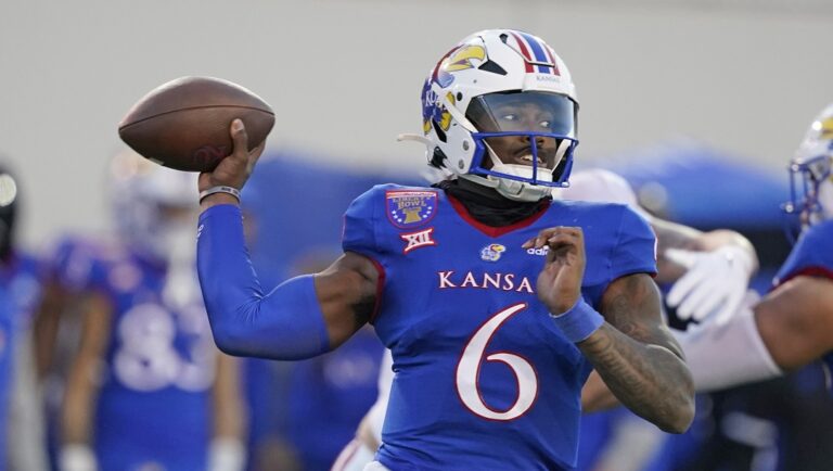 Kansas quarterback Jalon Daniels throws a pass against Arkansas during the first half of the Liberty Bowl NCAA college football game Wednesday, Dec. 28, 2022, in Memphis, Tenn.