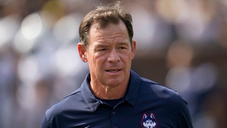 Connecticut head coach Jim Mora watches before an NCAA college football game against Michigan in Ann Arbor, Mich., Saturday, Sept. 17, 2022. (AP Photo/Paul Sancya)