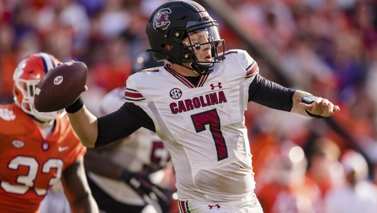 South Carolina quarterback Spencer Rattler (7) throws against Clemson during an NCAA college football game Nov. 26, 2022, in Clemson, S.C. Rattler needed answers before deciding on the NFL. He got all the right ones from his teammates and new offensive coordinator Dowell Loggains to stick around for another season.