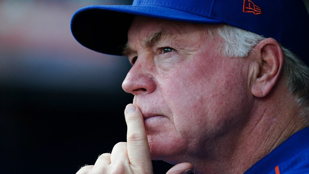 New York Mets manager Buck Showalter (11) looks on in the dugout before the start of a baseball game against the Atlanta Braves Monday, Aug. 21, 2023, in Atlanta.