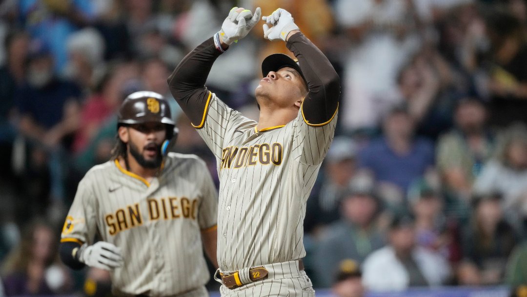 San Diego Padres' Juan Soto celebrates as he crosses home plate after hitting a three-run home run against Colorado Rockies relief pitcher Tommy Doyle in the fifth inning of a baseball game Tuesday, Aug. 1, 2023, in Denver.