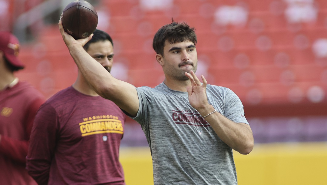 Washington Commanders quarterback Sam Howell (14) throws before an NFL preseason football game against the Baltimore Ravens, Monday, August 21, 2023 in Landover.