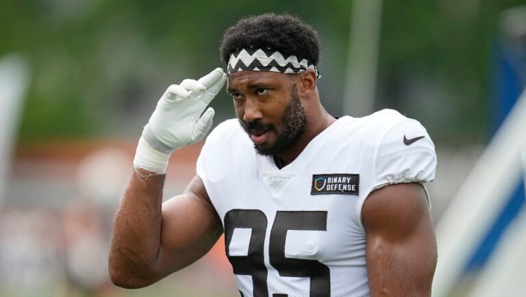 Cleveland Browns' Myles Garrett gestures to fans during an NFL football camp, Monday, Aug. 7, 2023, in Berea, Ohio.