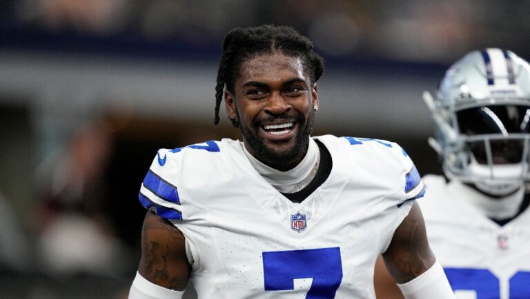 Dallas Cowboys cornerback Trevon Diggs smiles as he talks with teammate during warmups before a presesaon NFL football game against the Jacksonville Jaguars in Arlington, Texas, Saturday, Aug. 12, 2022. (AP Photo/Tony Gutierrez)