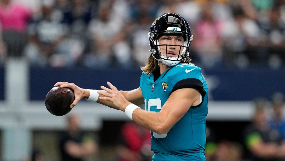 Jacksonville Jaguars quarterback Trevor Lawrence drops back to pass during a presesaon NFL football game against the Dallas Cowboys in Arlington, Texas, Saturday, Aug. 12, 2022.